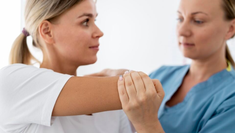 physiotherapist-helping-young-female-patient-her-clinic-scaled shoulder impingement physiotherapy in Islamabad