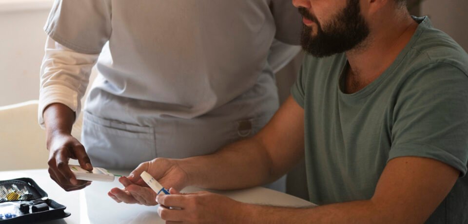 close-up-nurse-helping-diabetic-person-checking-their-glucose-levels Physiotherapy for Diabetes Management - AR Clinics